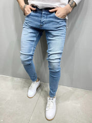 Jeans hombres la cintura elástica jeans flacos hombres estirando pantalones rasgados